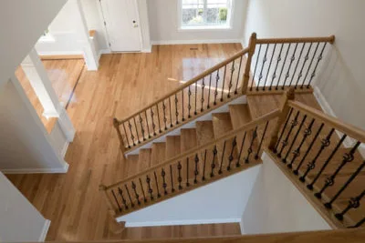 A house with hardwood floors and stair railings.